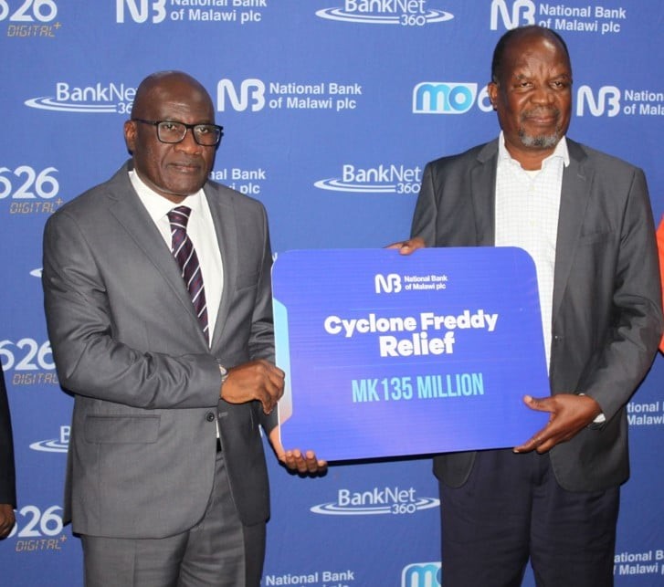NBM Chief Executive Officer (left) Macfussy Kawawa handing over a dummy cheque for the donation NBM Chief Executive Officer left Macfussy Kawawa handing over a dummy cheque for the donation
