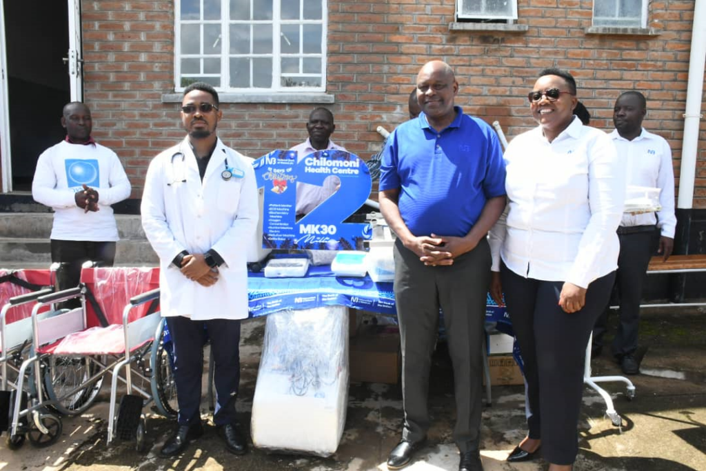 Kasunda (right) handing over medical equipment to Chilomoni Health Centre NBM donates K33m to Chilomoni Health Centre concludes 12 Days of Christmas