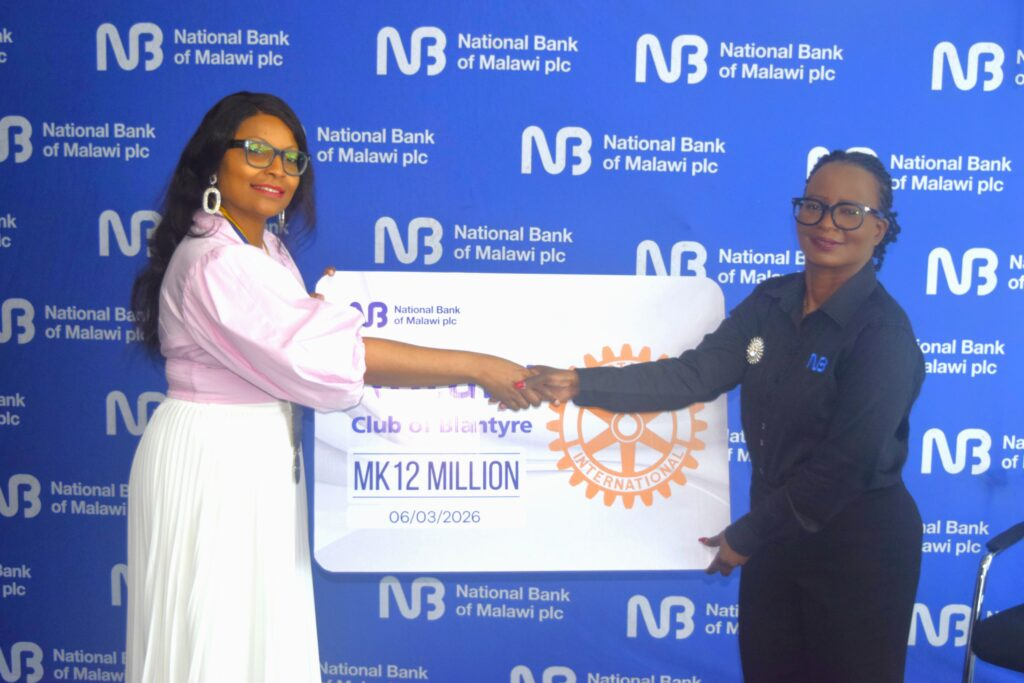 Malikula(Right) handing over the cheque to Khomani NBM gives K12 million to Rotary Club of Blantyre to support rural healthcare
