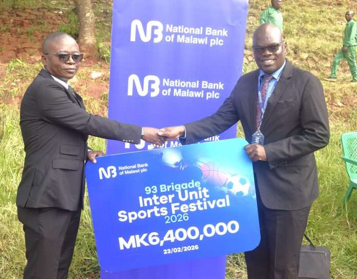 Singano (right) handing over the symbolic cheque to Kondowe Singano (right) handing over the symbolic cheque to Kondowe