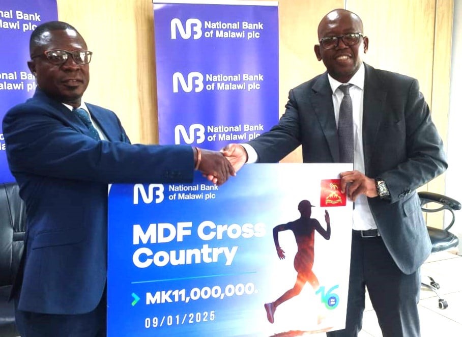 Mzungu (Right) presenting Symbolic Cheque to Yetala (Left) Mzungu (Right) presenting Symbolic Cheque to Yetala (Left)