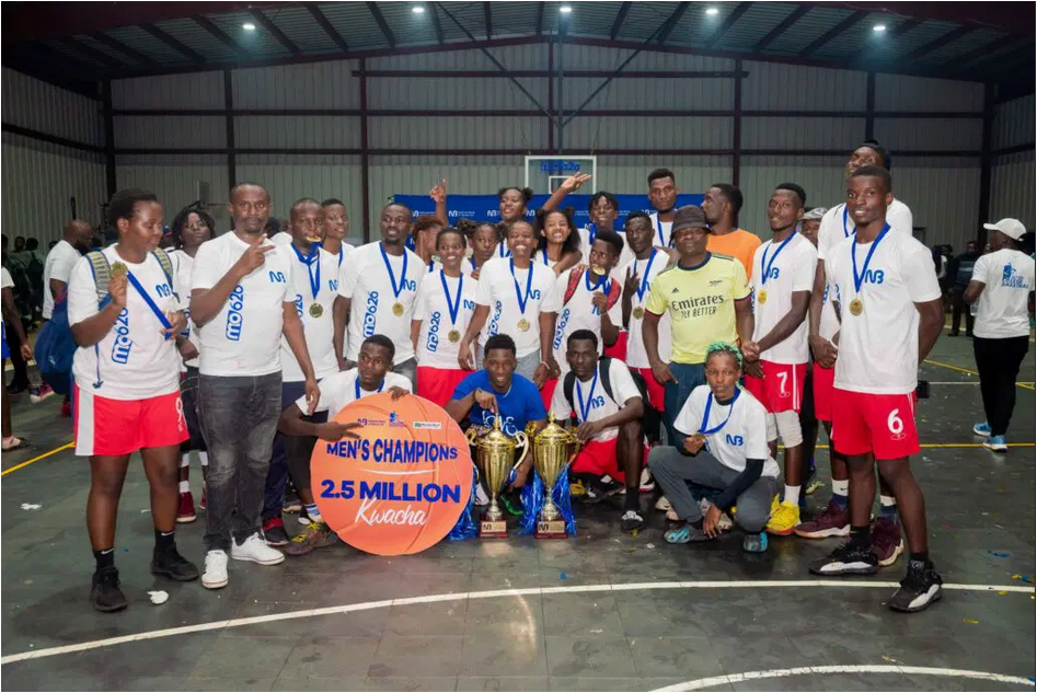 Triumphant- Magu Wolves and Magu she-wolves players and officials pose with their trophies